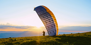 A man paragliding - by Juliette G.