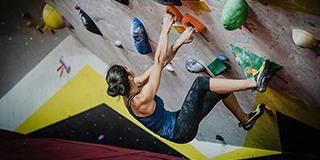 Girl climbing in a gym - by yns plt
