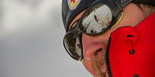 Mountain rescuer watching the snow