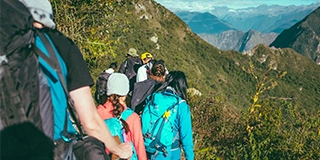 People walking beside the mountain - by Ashim D’Silva